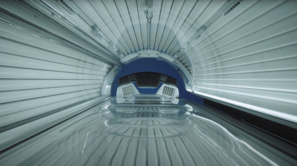 Client in the Ergoline Vitality 50/4 PLT3 tanning bed